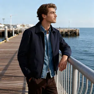 Men's navy blue zip-up commuter jacket with a classic collar in a pier setting
