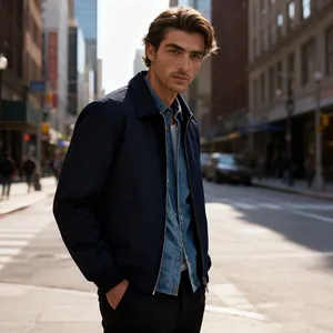 Detailed view of men's navy blue zip-up jacket in an urban street setting