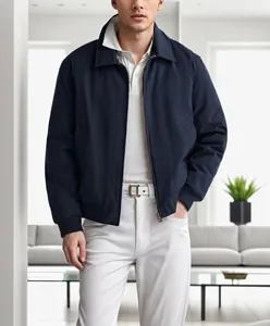 Close-up of navy blue men's zipper jacket with classic lapel collar in a modern setting