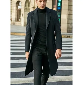 Detailed view of a classic British style long black woolen overcoat for men walking
