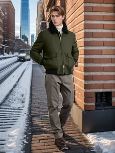 Stylish men's green wool jacket with black fur collar shown in a winter urban street setting.