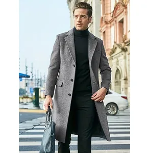 Detailed view of men's elegant long grey wool blend coat in an urban street setting