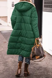 Back view of a long green hooded puffer coat featuring a warm quilted texture for winter