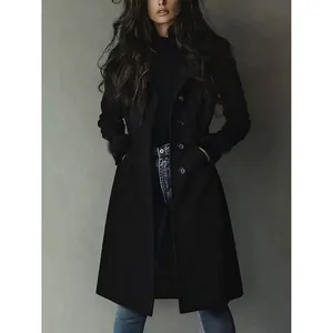 Detailed view of a black suede coat featuring a waist-cinching design and button closure