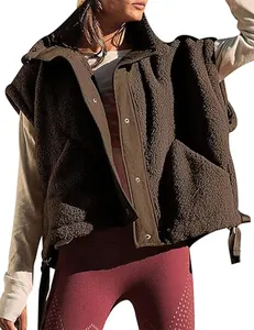 Close-up of a cozy brown sherpa vest with snap buttons for women's autumn fashion