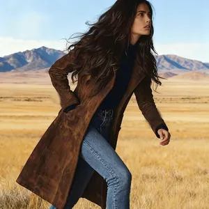 Detailed close-up of a women's long brown suede waisted coat featuring western style