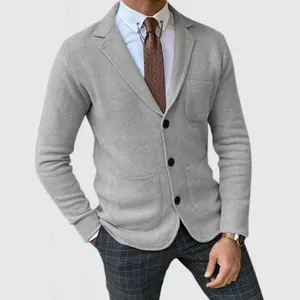 Detail shot of a grey slim-fit knitted blazer for men with a three-button design