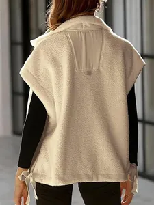 Back detail of women's beige sherpa vest featuring side ties and soft fleece texture