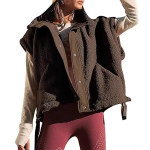 Oversized women's warm brown Sherpa fleece vest featuring pockets and snap buttons