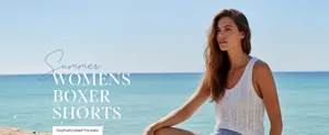 Lifestyle view of women's striped beach boxer shorts with sophisticated pockets