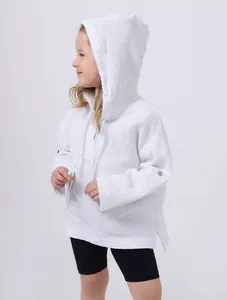 Side view detail of white muslin hooded shirt for kids showing breathable texture