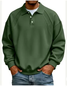 Close-up of olive green men's sweatshirt featuring ribbed shoulder detail and button lapel