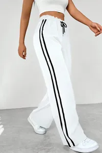 Women's white high waist wide leg sweatpants with side stripes and drawstring