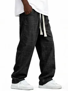 Vista detallada de pantalón holgado de algodón y lino para hombre con cordón y corte recto