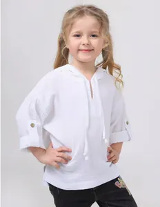 Detailed view of children's white hooded top made of breathable cotton linen fabric