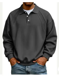 Detail view of charcoal gray polo sweatshirt with ribbed shoulder panels and white buttons