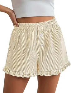 Detail view of women's Y2K striped shorts with ruffle hem and decorative buttons.
