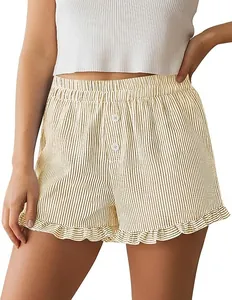 Close-up of women's striped lounge shorts with cute ruffle hem and decorative buttons