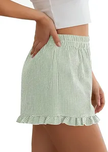 Side view detail of women's green striped Y2K lounge shorts with ruffled hem