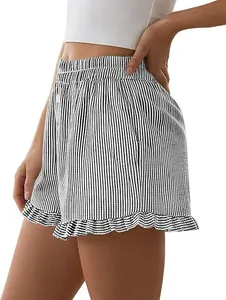 Side view detail of stylish women's black and white striped shorts with cute ruffle hem