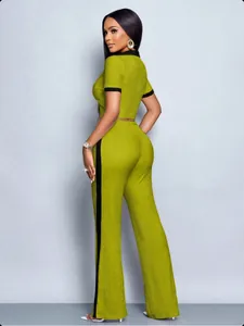 Back view of a stylish women's olive green ribbed 2-piece set with black contrast trim