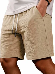 Close-up of khaki textured casual shorts featuring drawstring waist and side pocket