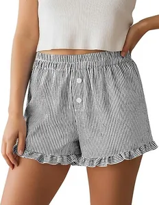 Close-up of womens striped loungewear shorts with ruffle hem and button details.