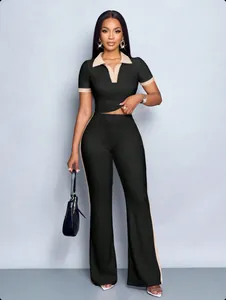 Detail view of women's ribbed two-piece set featuring contrast collar polo top and trousers