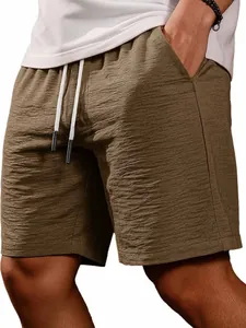 Close-up of men's textured brown summer casual shorts with adjustable drawstring.