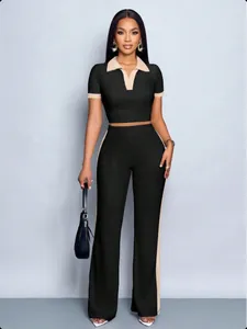 Full-body view of women's 2-piece set with contrast polo top and side-striped wide-leg pants
