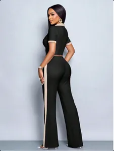 Side view of women's slim-fit 2-piece set with polo top and side-striped wide-leg pants