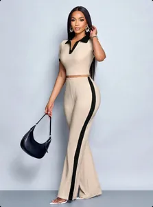 Detailed view of women's two-piece set with contrast collar and side-striped pants