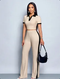 Detailed view of women's summer 2-piece set with slim-fit polo top and striped pants