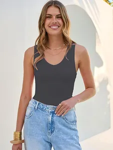 Close-up detail of a grey ribbed V-neck tank top worn by a model in outdoor light