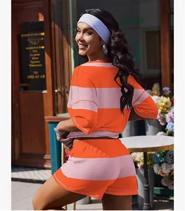 Back view of orange and pink striped short sleeve top and shorts set for women