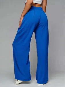 Back view of women's royal blue high-waisted wide-leg trousers with elegant drape