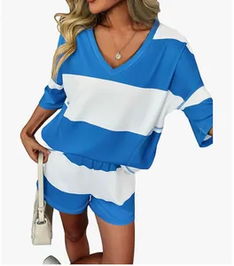 Detail view of a blue and white striped two-piece set featuring a V-neck top and shorts
