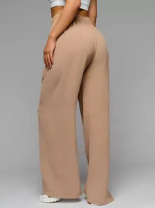 Detail view of khaki wide-leg pants showing the textured fabric and flowy floor-length fit.