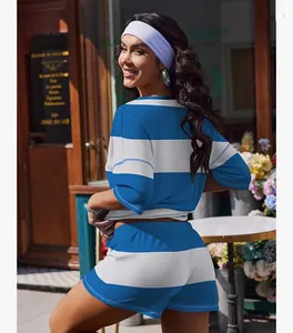 Back view of blue and white striped two-piece lounge set in outdoor street setting