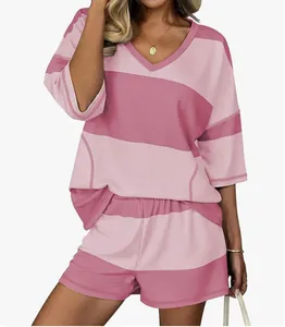 Detail shot showing the texture and striped pattern of the pink casual outfit