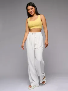 Stylish high-waisted wide-leg loose white trousers with a textured drawstring waist