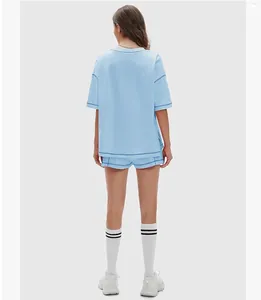 Rückansicht von hellblauem Damen Baumwolle Set aus T-Shirt und Shorts mit Kontrastnähten