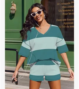 Stylish woman wearing a teal striped V-neck top and matching shorts two-piece set