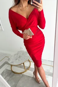 Close-up detail of a vibrant red V-neck ruched bodycon midi dress with long sleeves