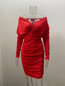 Close-up detail of the red long-sleeved V-neck ruched bodycon mini dress for women