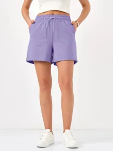 Detailed view of purple women's casual shorts with elastic drawstring waist and pockets