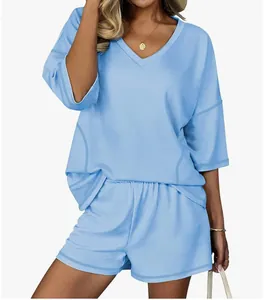 Comfortable light blue women's two-piece loungewear set with v-neck top and shorts