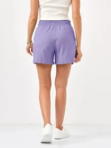 Back view of women's purple casual sports shorts featuring a comfortable elastic waist