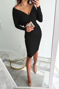 Detailed view of an elegant black long-sleeved V-neck ruched bodycon dress on a model