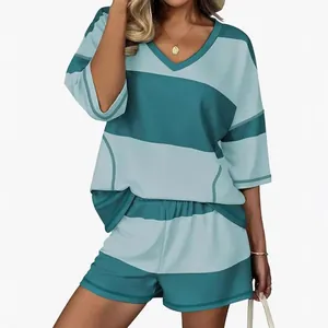 Professional studio shot of women's two-piece striped casual set with V-neck top and shorts
